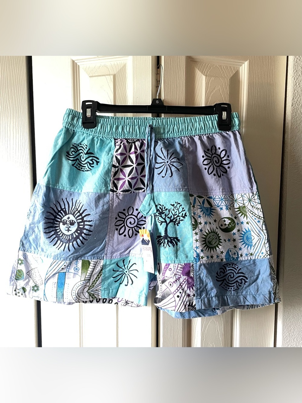 Rising International Turquoise, Light Blue & Purple Patchwork Board Shorts